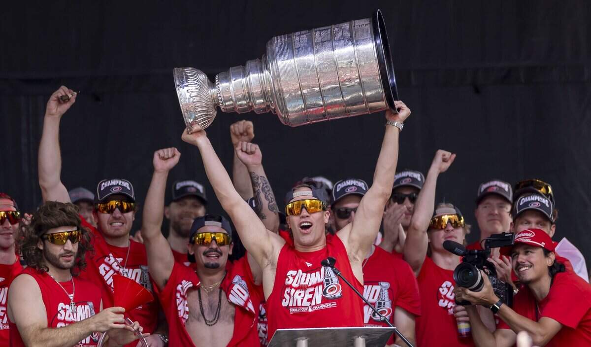 Carolina Hurricanes left wing Taylor Hall (71) hoists the Stanley Cup, during the rally on the City Plaza on Saturday, June 20, 2026 in Raleigh, NC.
