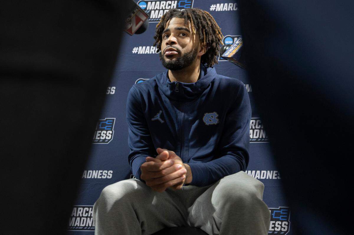 North Carolina’s R.J. Davis (4) is surround by reporters as he takes questions during the Tar Heels’ media availability on Friday, March 22, 2024 at Spectrum Center in Charlotte, N.C.