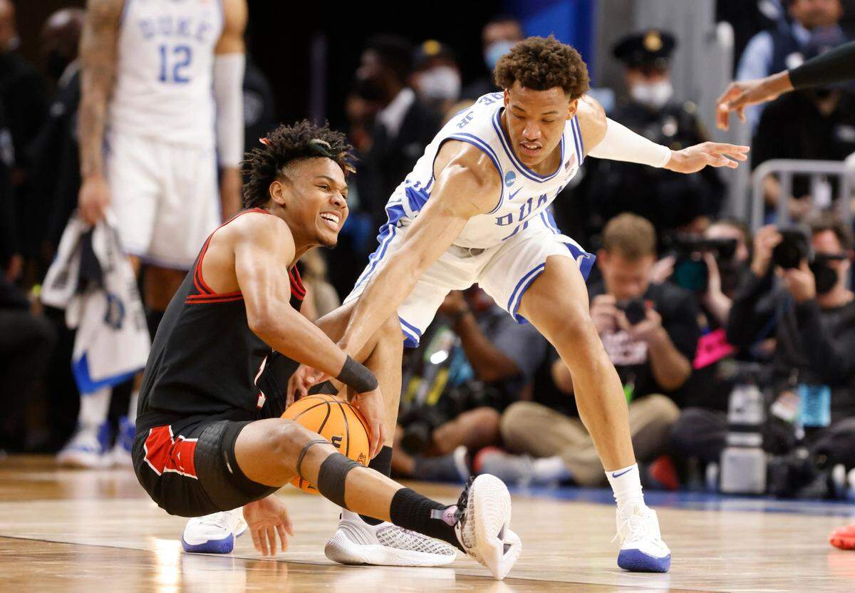 Dukes Wendell Moore Jr. (0) goes for the ball with Texas Tech’s Terrence Shannon Jr. (1) during the first half of Dukes game against Texas Tech in the Sweet 16 round of the NCAA Tournament at the Chase Center in San Francisco, Calif., Thursday, March 24, 2022.
