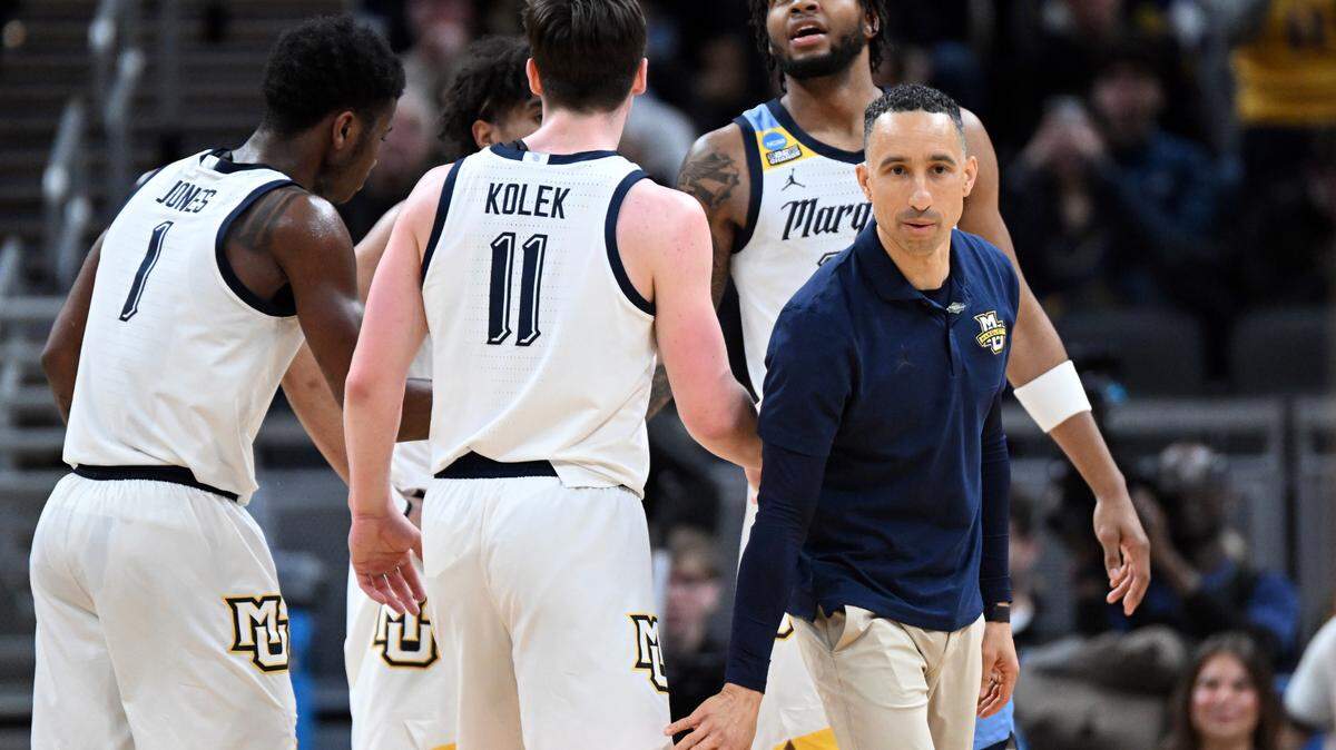 Mar 22, 2024; Indianapolis, IN, USA; Marquette Golden Eagles head coach Shaka Smart reacts with guard Tyler Kolek (11) in the second half against the Western Kentucky Hilltoppers in the first round of the 2024 NCAA Tournament at Gainbridge FieldHouse. Mandatory Credit: Robert Goddin-USA TODAY Sports