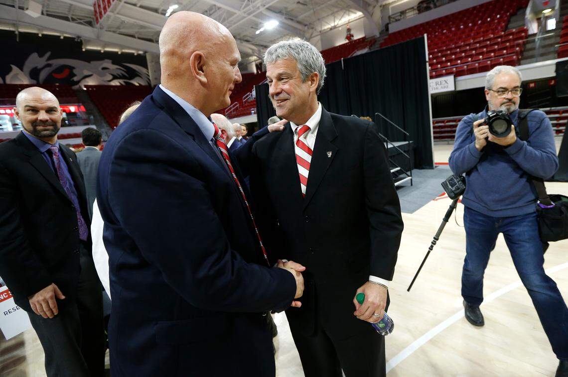 Boo Corrigan, right, greets Gen. Ray Odierno after Corrigan was introduced as N.C. State’s new athletic director during a press conference at Reynolds Coliseum in Raleigh, N.C., Thursday, Jan. 31, 2019.