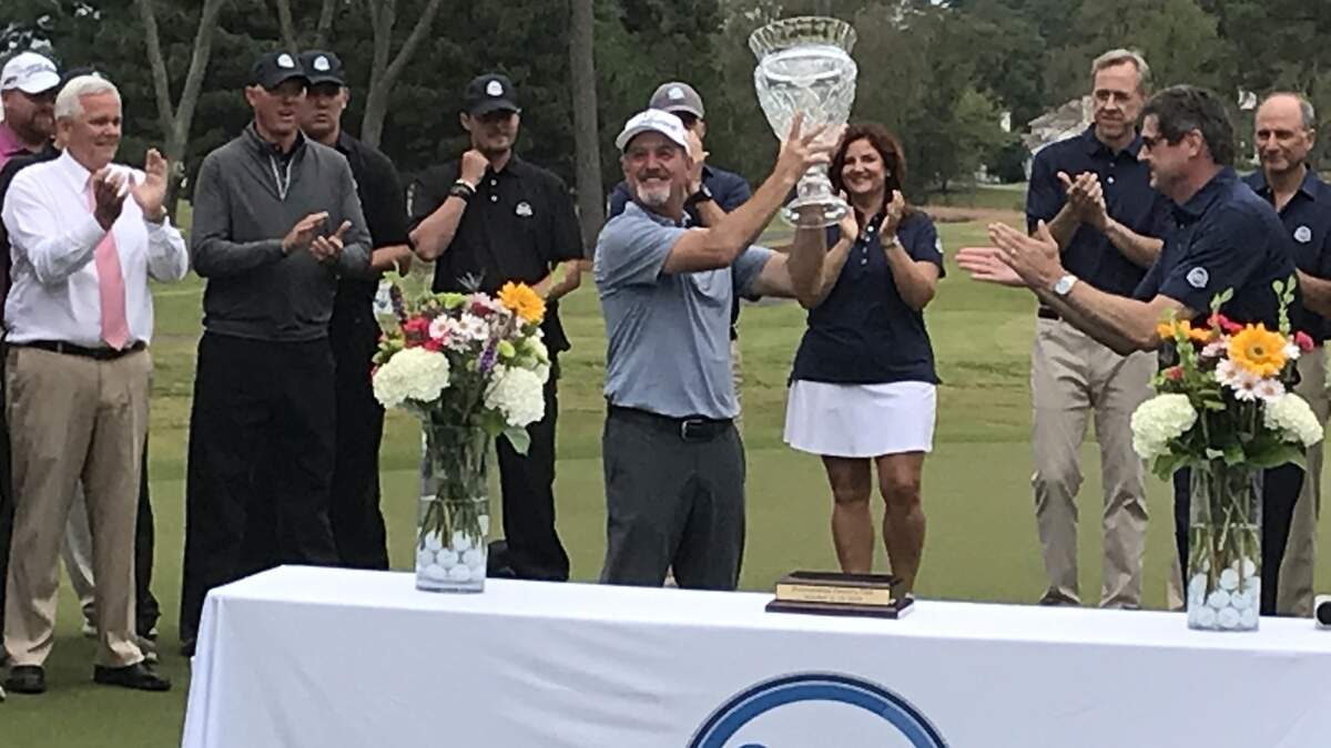 Jerry Kelly shows off the winning hardware at 18th hole ceremony after one-shot victory in SAS Championship on Oct. 13, 2019 at Prestonwood Country Club.