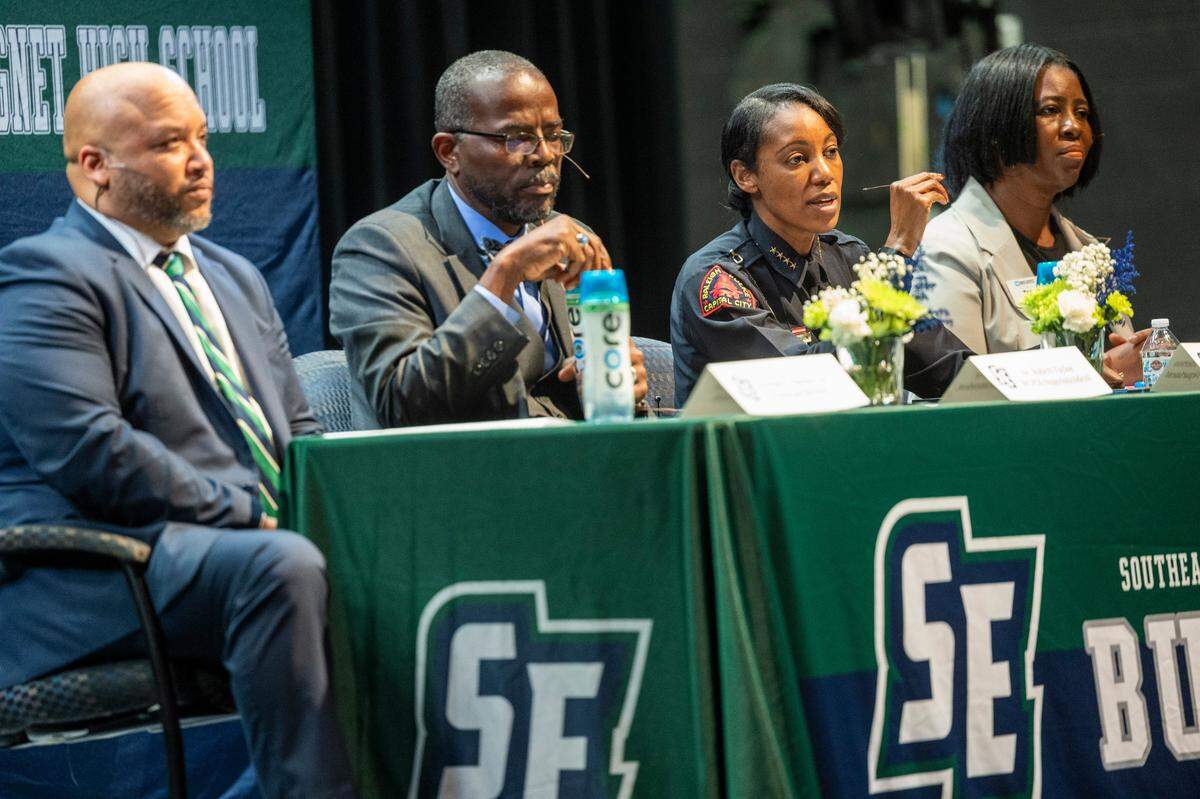 Raleigh Police Chief Estella Patterson, third from left, speaks during a community forum Monday, Dec. 4, 2023 at Southeast Raleigh High School, one week after a brawl resulted in the fatal stabbing of a 15-year-old student and the wounding of a 16-year-old.