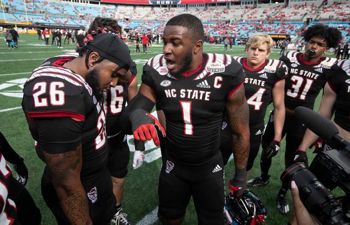 N.C. State linebacker Isaiah Moore (1) pumps up the linebackers before N.C. State’s game against Maryland in the Duke’s Mayo Bowl at Bank of America Stadium in Charlotte, N.C., Friday, Dec. 30, 2022.