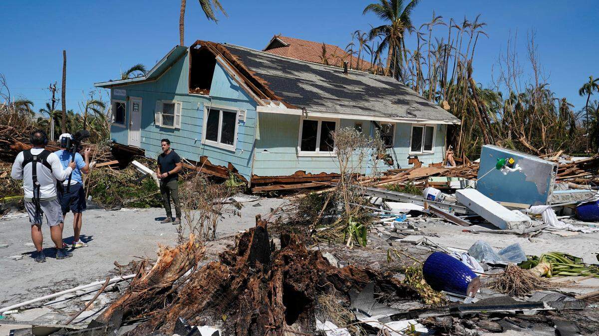 A TV news crew works on Sanibel Island, in Lee County Florida, in the aftermath of Hurricane Ian on Sept. 30, 2022. North Carolina is sending two teams of emergency managers to Lee County to help with recovery efforts there.