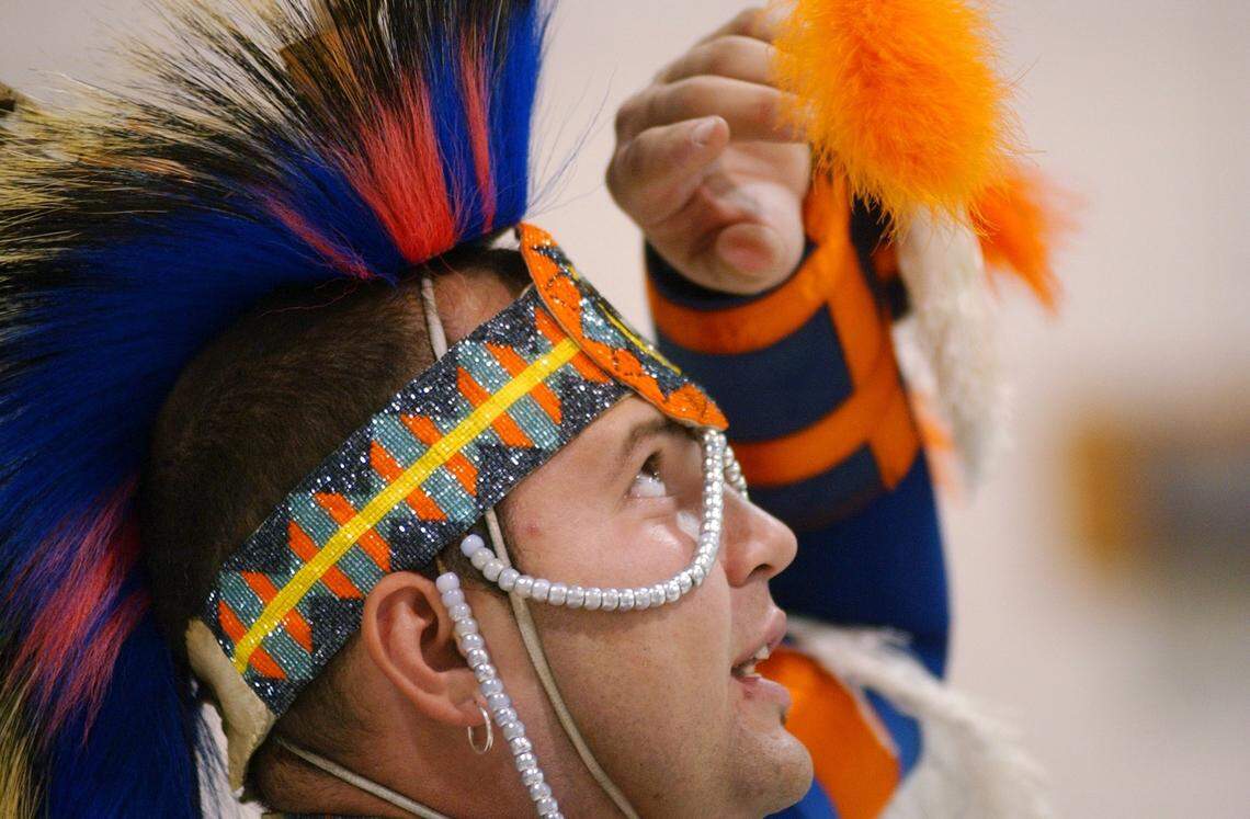 Billy Hunt of Pembroke, NC talks about his traditional, handmade Lumbee Indian outfit to Little River Elementary students in the gymnasium on in 2005.