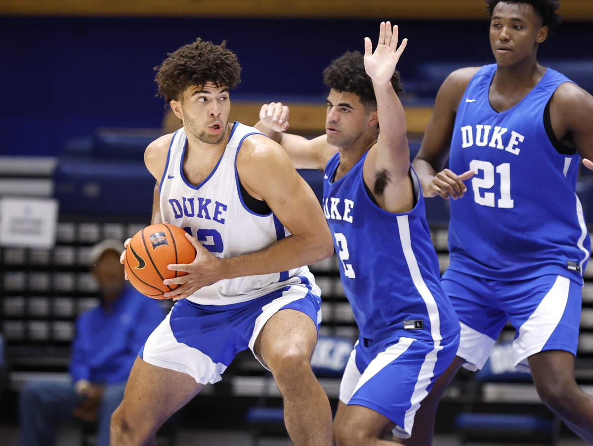 Duke’s Cayden Boozer (2) defends his twin brother Cameron Boozer (12) during a scrimmage during the Blue Devils’ open practice at Cameron Indoor Stadium in Durham, N.C., Tuesday, August 5, 2025.