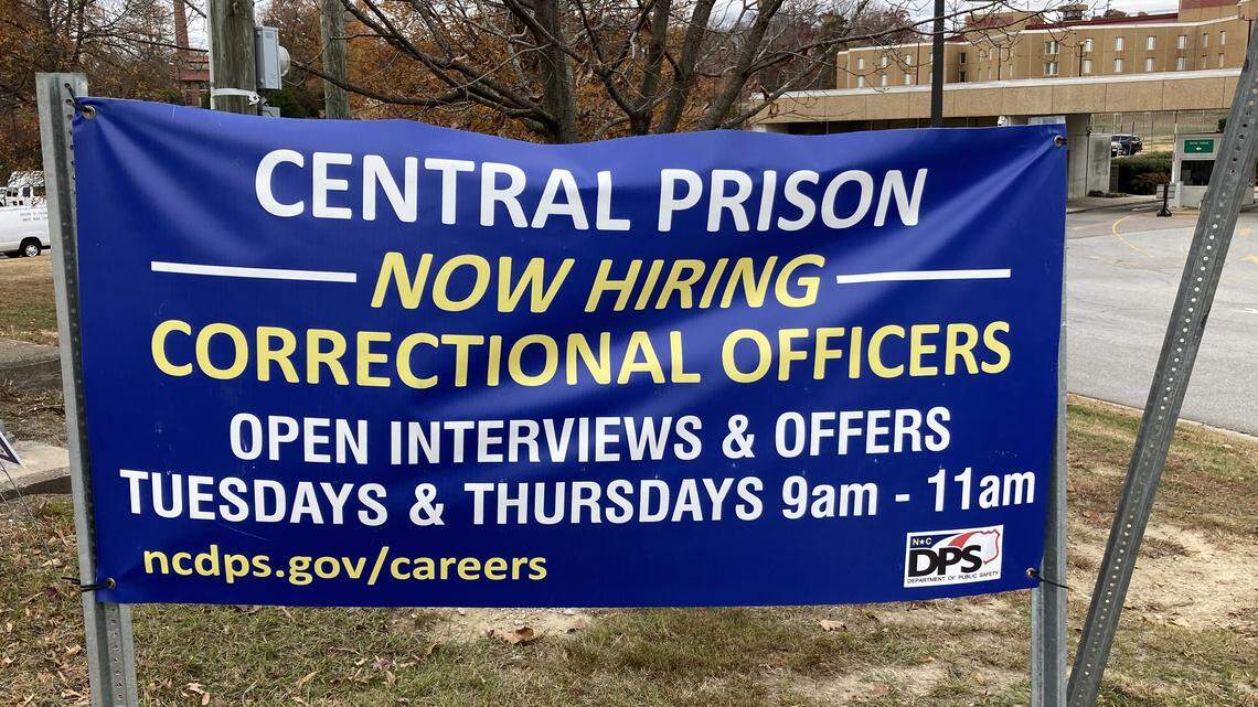 A sign seeking correctional officers stands outside of Central Prison in Raleigh.