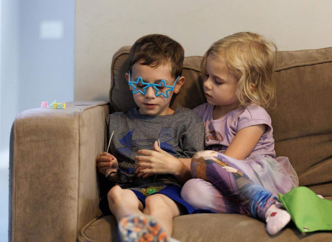 Arya Futch, 6, sits with her brother, Landyn Futch, 10, at their home in Wake Forest.