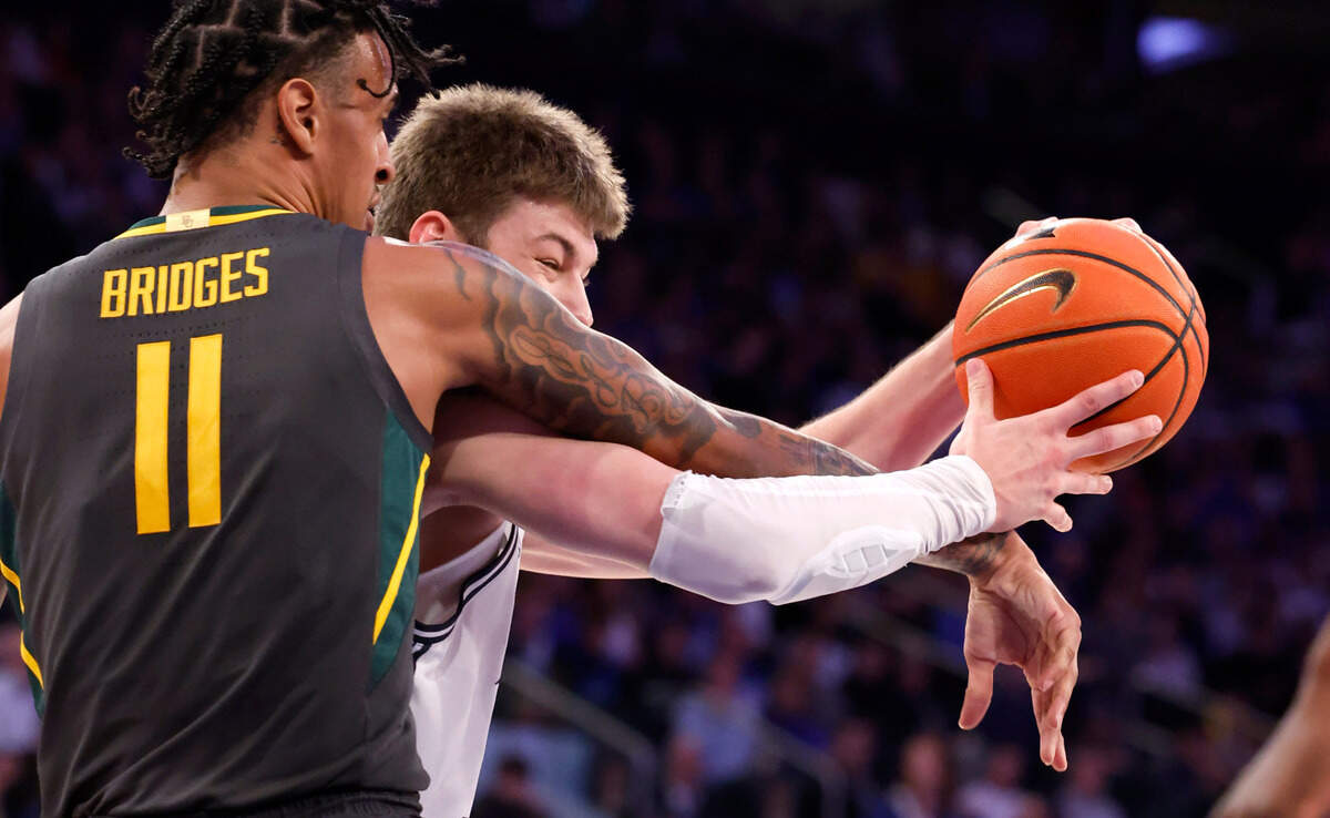 Baylor’s Jalen Bridges (11) defends Duke’s Kyle Filipowski (30) during the second half of Duke’s 78-70 victory over Baylor at Madison Square Garden in New York City Wednesday, Dec. 20, 2023.