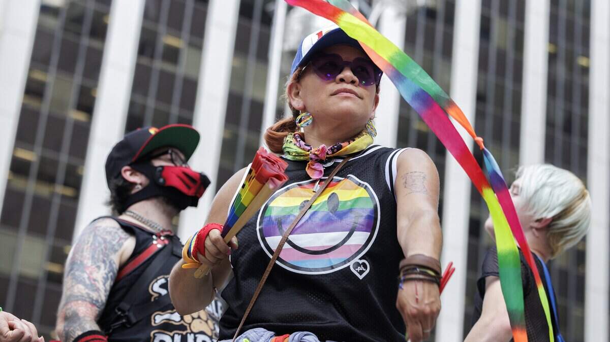 Sandra Herrera Sandy (center) danced alongside others near the stage on Fayetteville St. at Out! Raleigh Pride on Saturday in downtown Raleigh.


