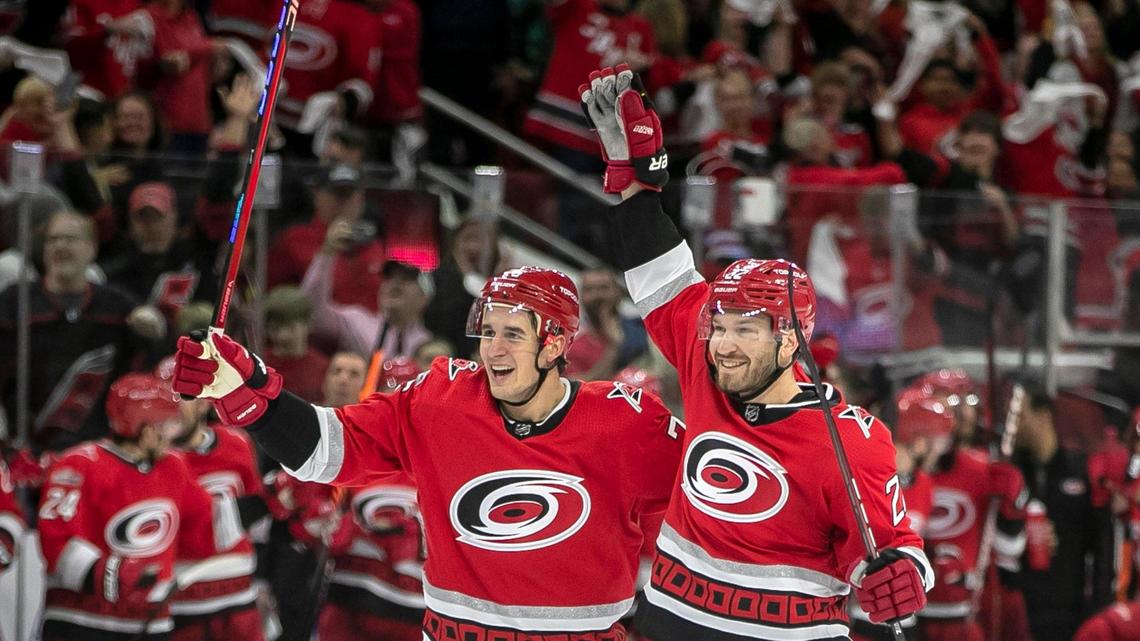 The Carolina Hurricanes Brett Pesce (22) reacts after scoring on New Jersey Devils goalie Akira Schmid (40) in the first period during Game 1 of their second round Stanley Cup playoff series on Wednesday, May 3, 2023 at PNC Arena in Raleigh, N.C.