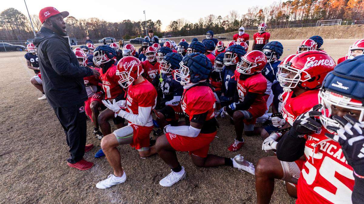 Louisburg College Head Football Coach Quinderra Spellman leads his team during their final practice on Tuesday, Dec. 3, 2004, in Louisburg. The team is heading to the NJCAA National Championship for the first time in the program’s 20-year history.