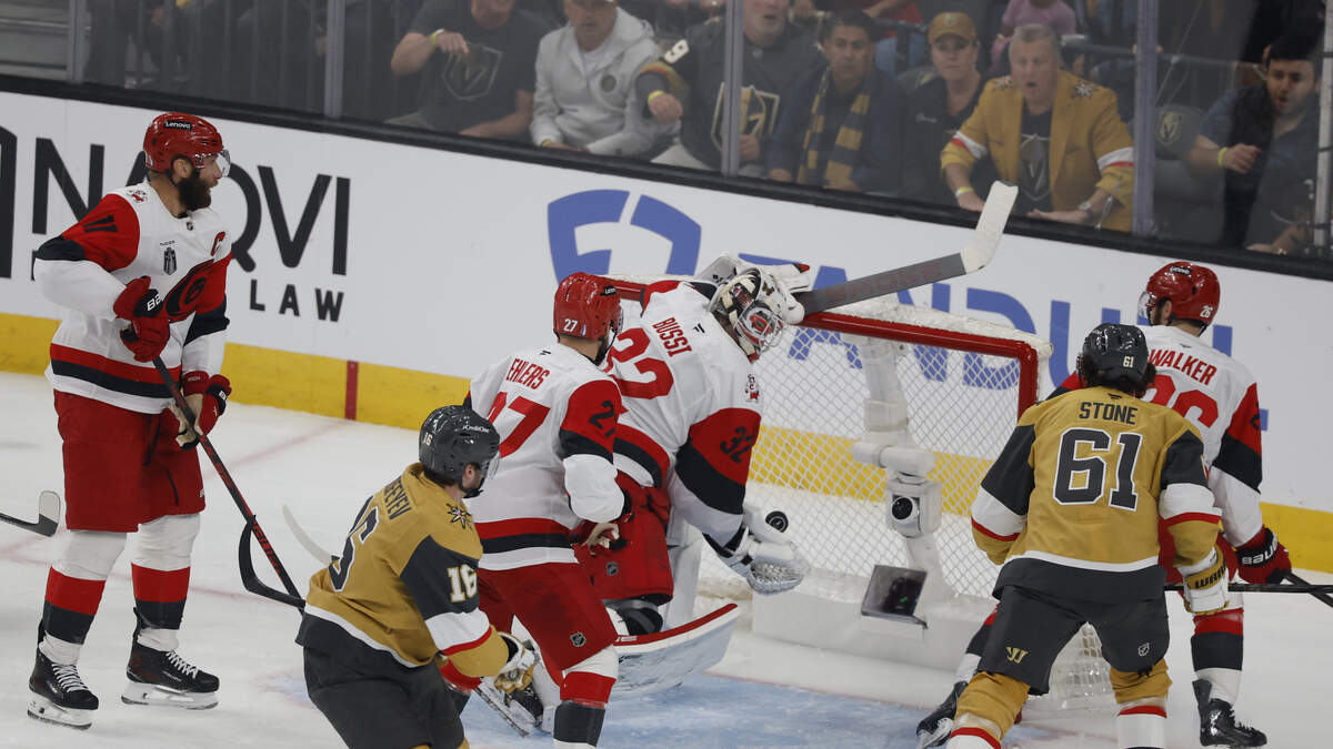 Hurricanes goalie Brandon Bussi plucks the puck out of the air to make a miracle save in the first period against Vegas.