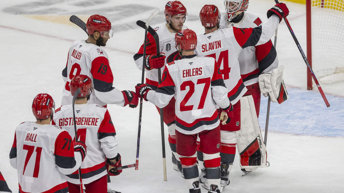 Carolina Hurricanes players line up to congratulate goalie Brandon Bussi (32) after the Hurricanes’ 5-3 victory over Vegas in Game 4 of the Stanley Cup Final Tuesday.