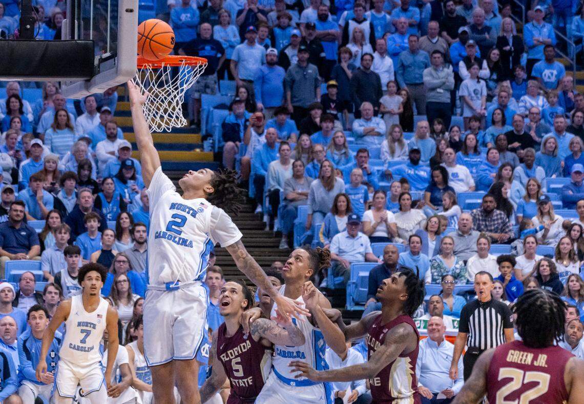 North Carolina’s Elliot Cadeau (2) scores to give the Tar Heels’ a 58-56 lead, after overcoming a fourteen point Florida State lead, in the second half on Saturday, December 2, 2023 at the Smith Center in Chapel Hill, N.C.