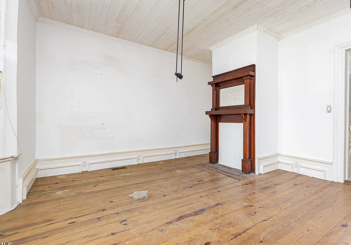 A photo of the living room at 421 Grigsby Ave. in Holly Springs, which has sat abandoned and neglected for years.