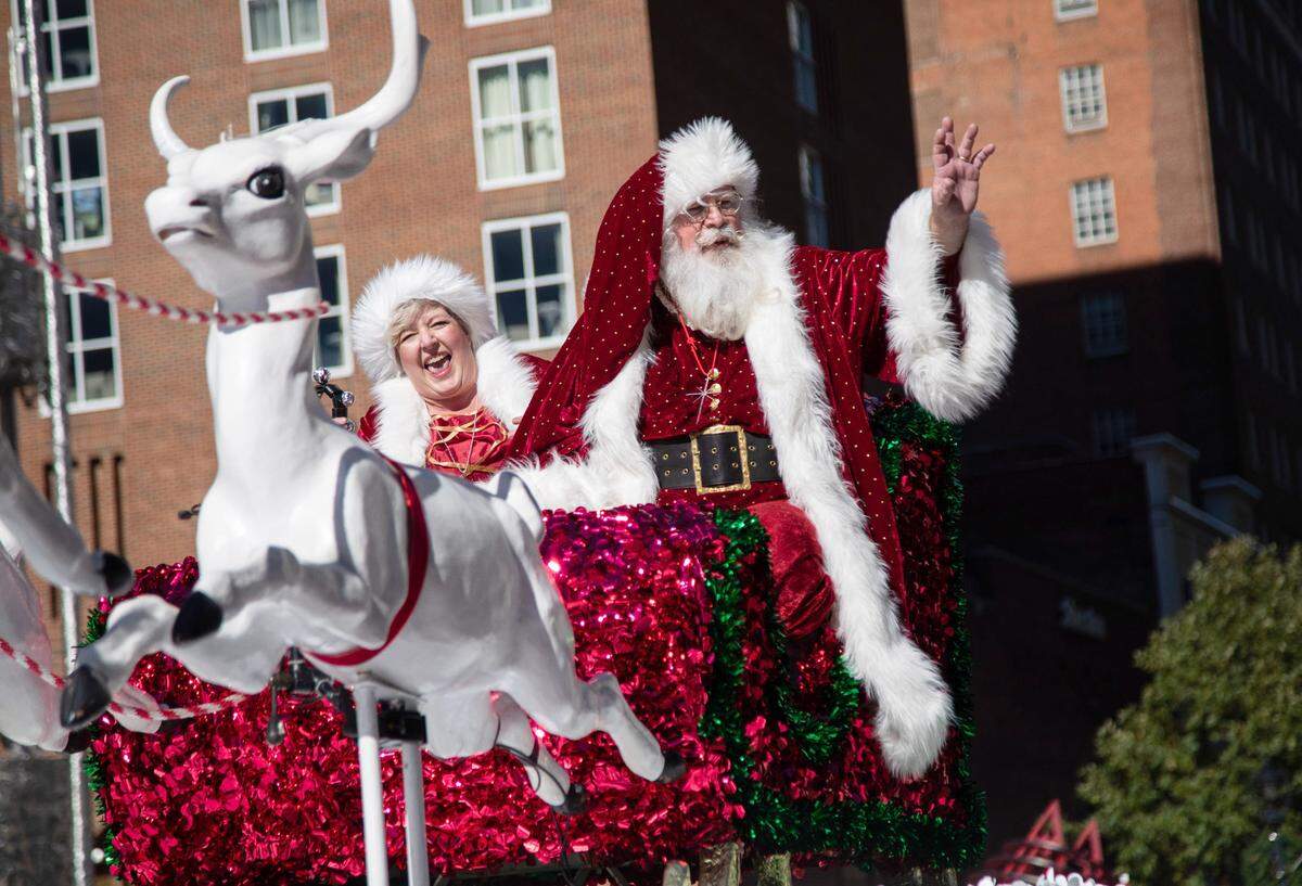 In this 2018 file photo, Santa Claus and Mrs. Claus wave to the crowd during Raleigh’s annual Christmas parade Saturday, Nov. 17, 2018 on Fayetteville Street in downtown Raleigh.