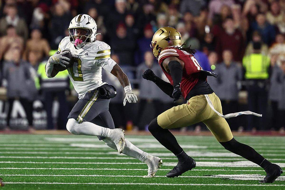 Malachi Hosley (0) of the Georgia Tech Yellow Jackets tries to get around Omar Thornton (0) of the Boston College Eagles during the fourth quarter at Alumni Stadium on Nov. 15, 2025 in Boston, Massachusetts.