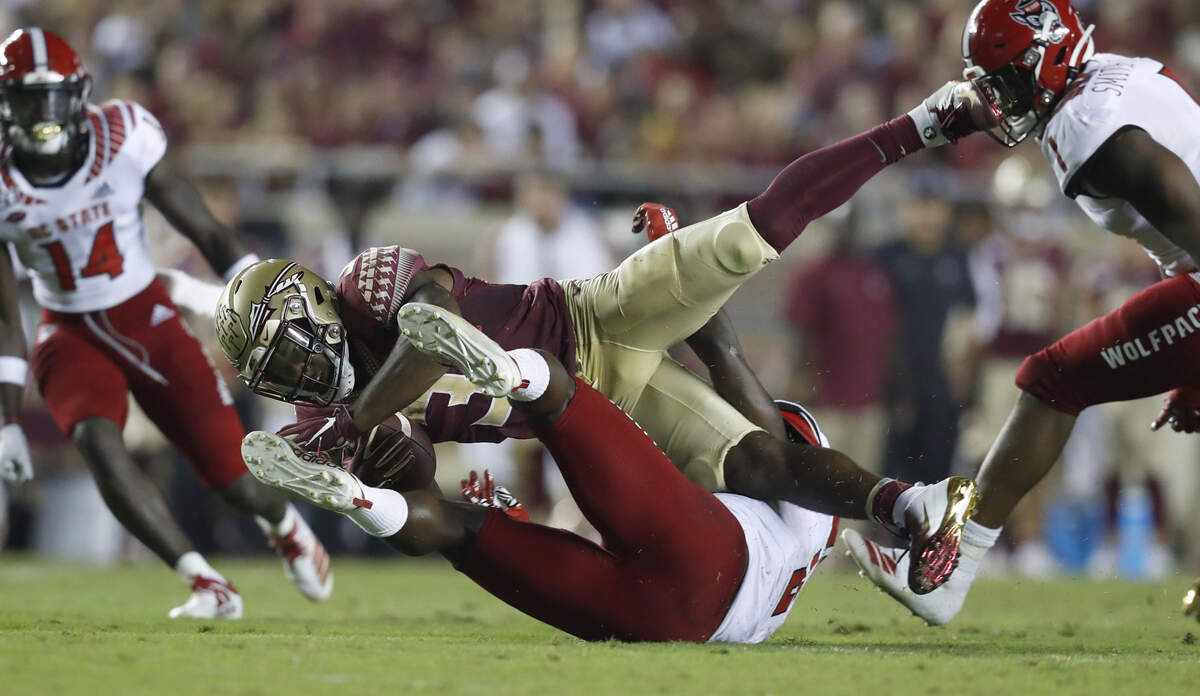 N.C. State linebacker Louis Acceus (2) tackles Florida State running back Cam Akers (3) during the second half of Florida State’s 31-13 victory over N.C. State at Doak Campbell Stadium in Tallahassee, Fla., Saturday, Sept. 28, 2019.