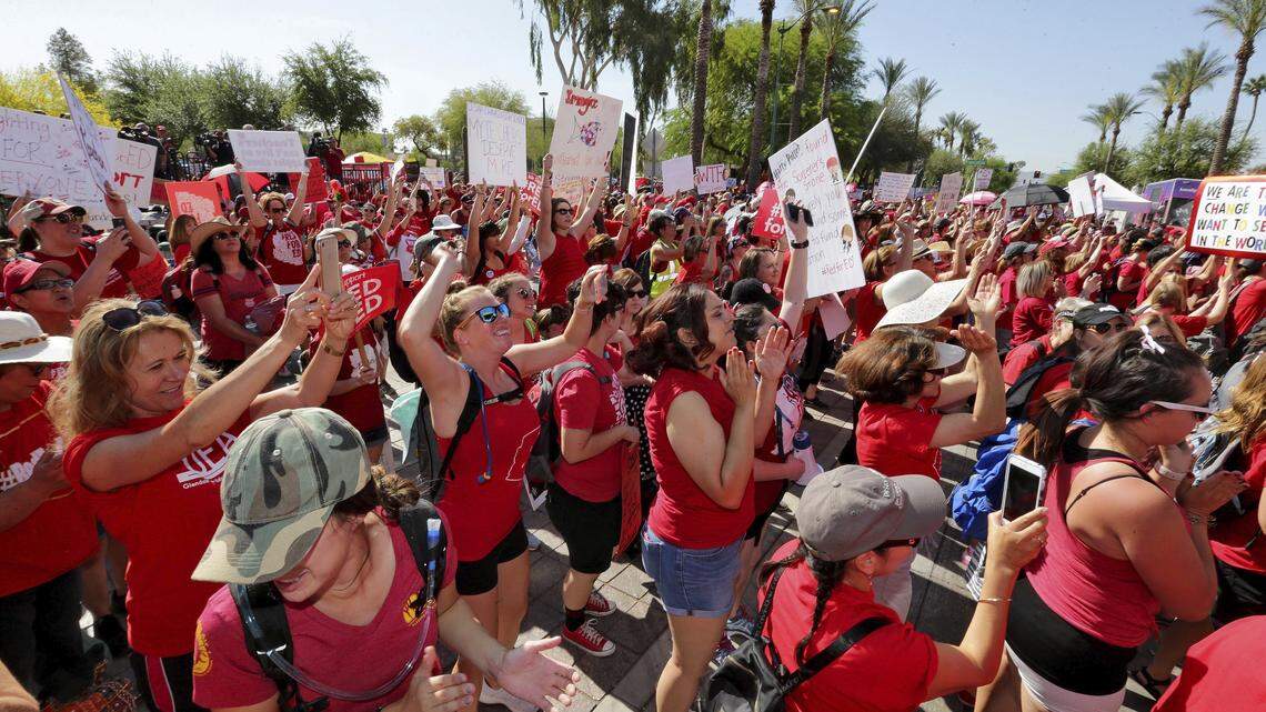 Teachers rally outside the Capitol, Friday, April 27, 2018, in Phoenix, on their second day of walkouts. Teachers in Arizona and Colorado walked out of their classes over low salaries keeping hundreds of thousands of students out of school. It's the latest in a series of strikes across the nation over low teacher pay.  Similar teacher demonstrations are expected in Raleigh on May 16.