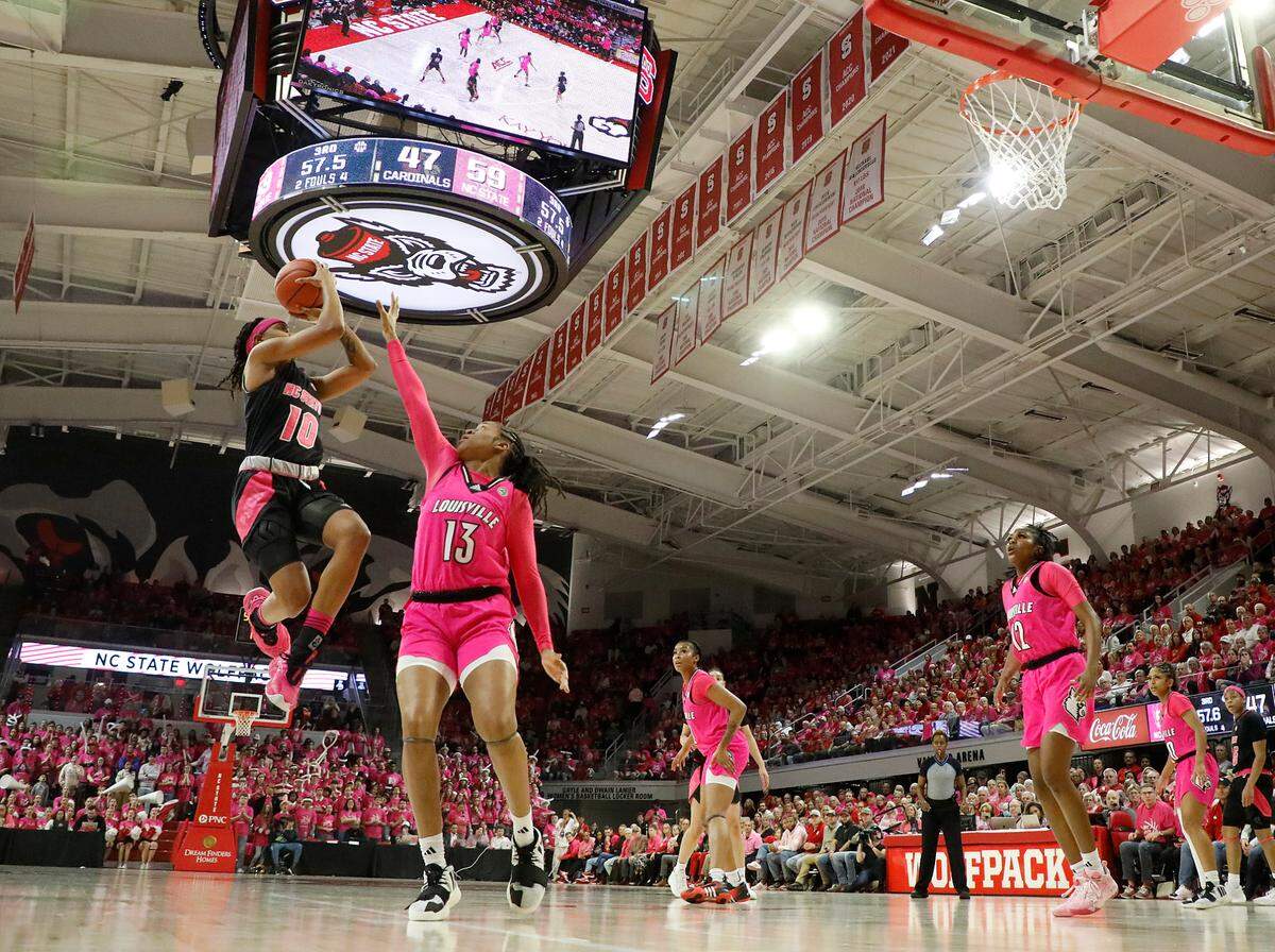 N.C. State’s Aziaha James shoots over Louisville’s Merissah Russell during the second half of the Wolfpack’s 77-67 win on Monday, Feb. 5, 2024, at Reynolds Coliseum in Raleigh, N.C.