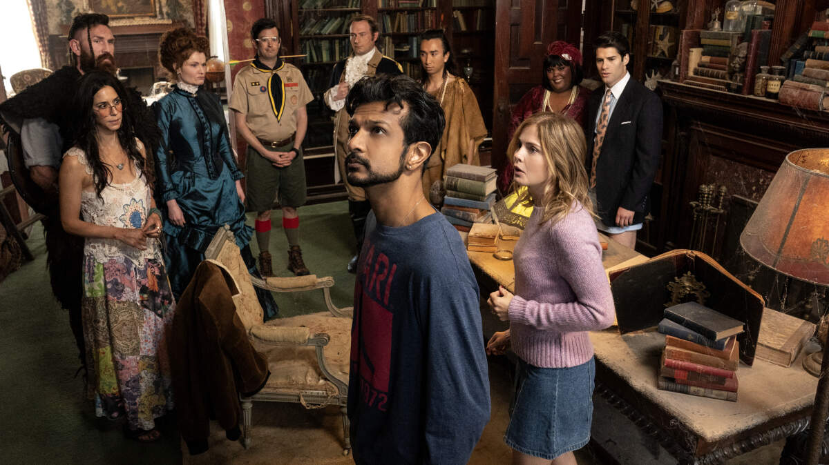 From the first episode of the new CBS comedy “Ghosts”: (Front Row L-R) Utkarsh Ambudkar as Jay and Rose McIver as Samantha. (Back Row L-R) Sheila Carrasco as Flower, Devan Chandler Long as Thorfinn, Rebecca Wisocky as Hetty, Richie Moriarty as Pete, Brandon Scott Jones as Isaac, Romn Zaragoza as Sasappis, Danielle Pinnock as Alberta and Asher Grodman as Trevor.