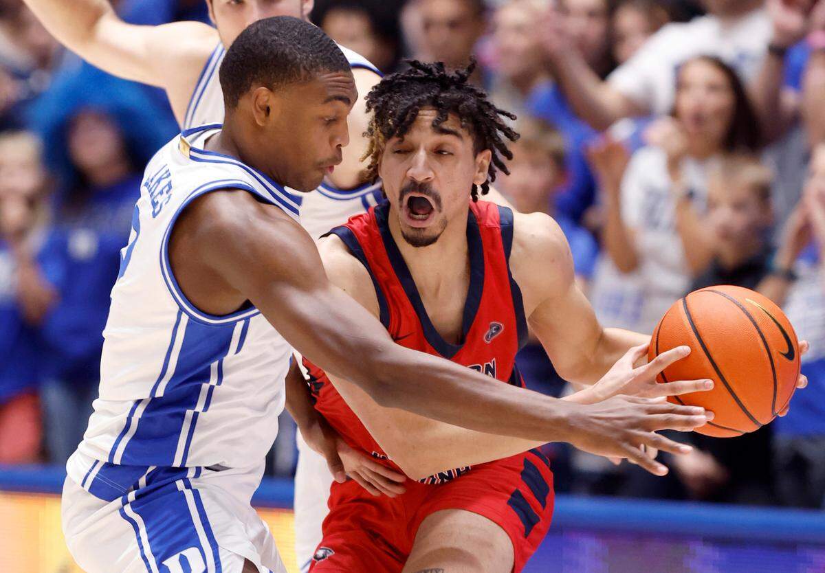 Duke’s Jaylen Blakes (2) defends Southern Indiana’s Jeremiah Hernandez (33) during the first half of Duke’s game against Southern Indiana at Cameron Indoor Stadium in Durham, N.C., Friday, Nov. 24, 2023.