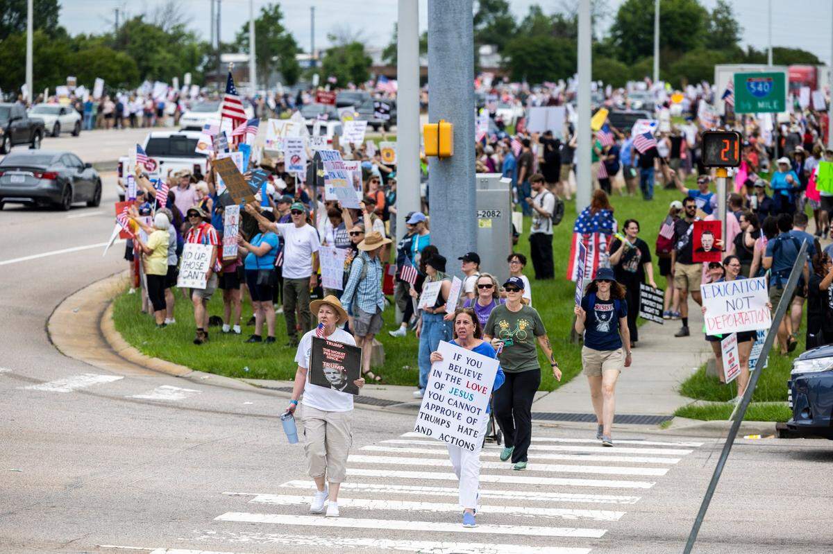 More than 1500 demonstrators lined Capital Boulevard to protest the policies and tactics of the of President Donald Trump on Saturday, June 14, 2025 near Triangle Town Center in Raleigh. The Raleigh “No Kings” rally was one of dozens across North Carolina and hundreds nationwide on what organizers called a nationwide day of defiance against the Trump administration.