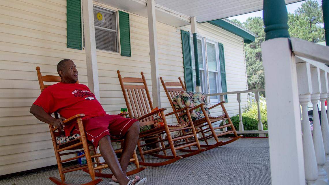 Ronnie Alston sits on the front porch of his home Tuesday Sept. 18, 2018, in Bucksport, SC. Alston’s home faces flooding from the Waccamaw and Great Pee Dee River.

