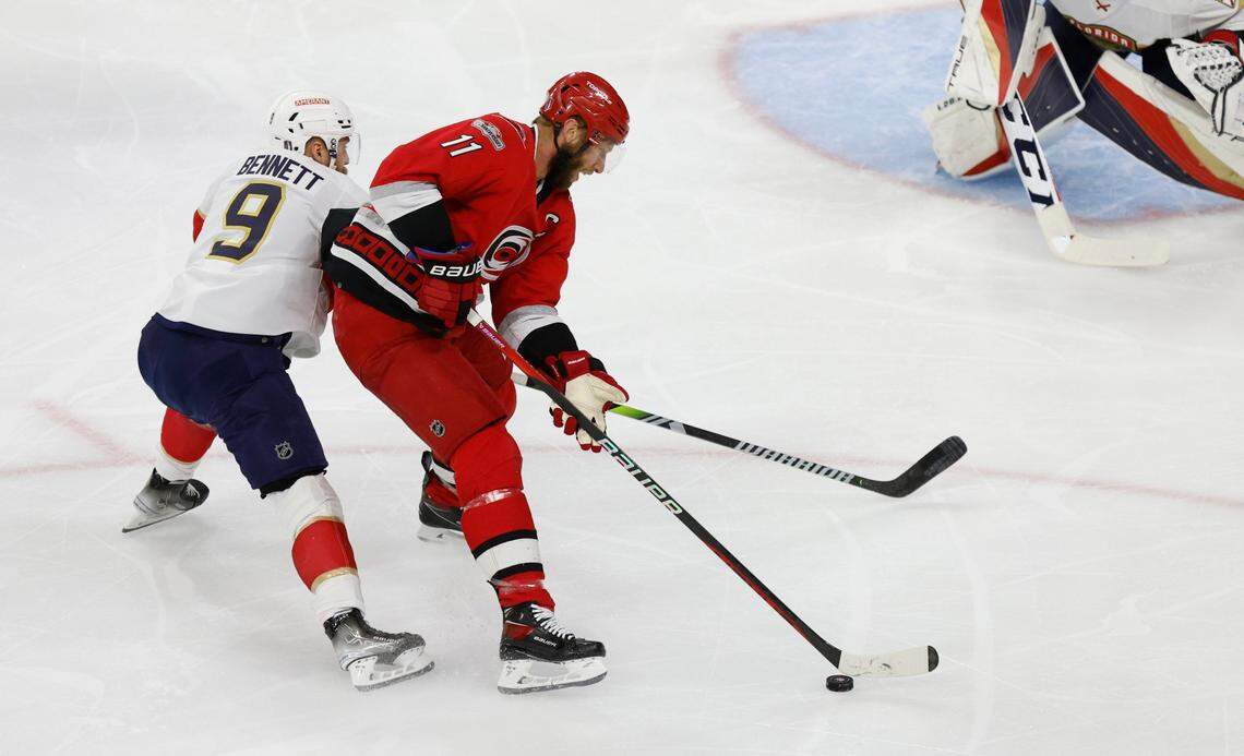 Carolina center Jordan Staal (11) keeps the puck from Florida center Sam Bennett (9) during the first period of game two between the Hurricanes and Panthers in the Eastern Conference Finals at PNC Arena in Raleigh, N.C., Saturday, May 20, 2023.