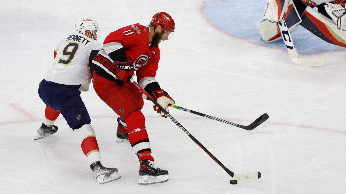 Carolina center Jordan Staal (11) keeps the puck from Florida center Sam Bennett (9) during the first period of game two between the Hurricanes and Panthers in the Eastern Conference Finals at PNC Arena in Raleigh, N.C., Saturday, May 20, 2023.