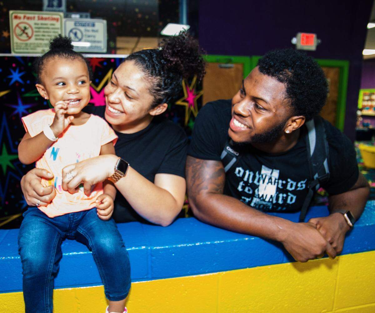 NC State running back Reggie Gallaspy in a recent photo with his girlfriend Jazmin Wilkerson and their daughter, Aliah.