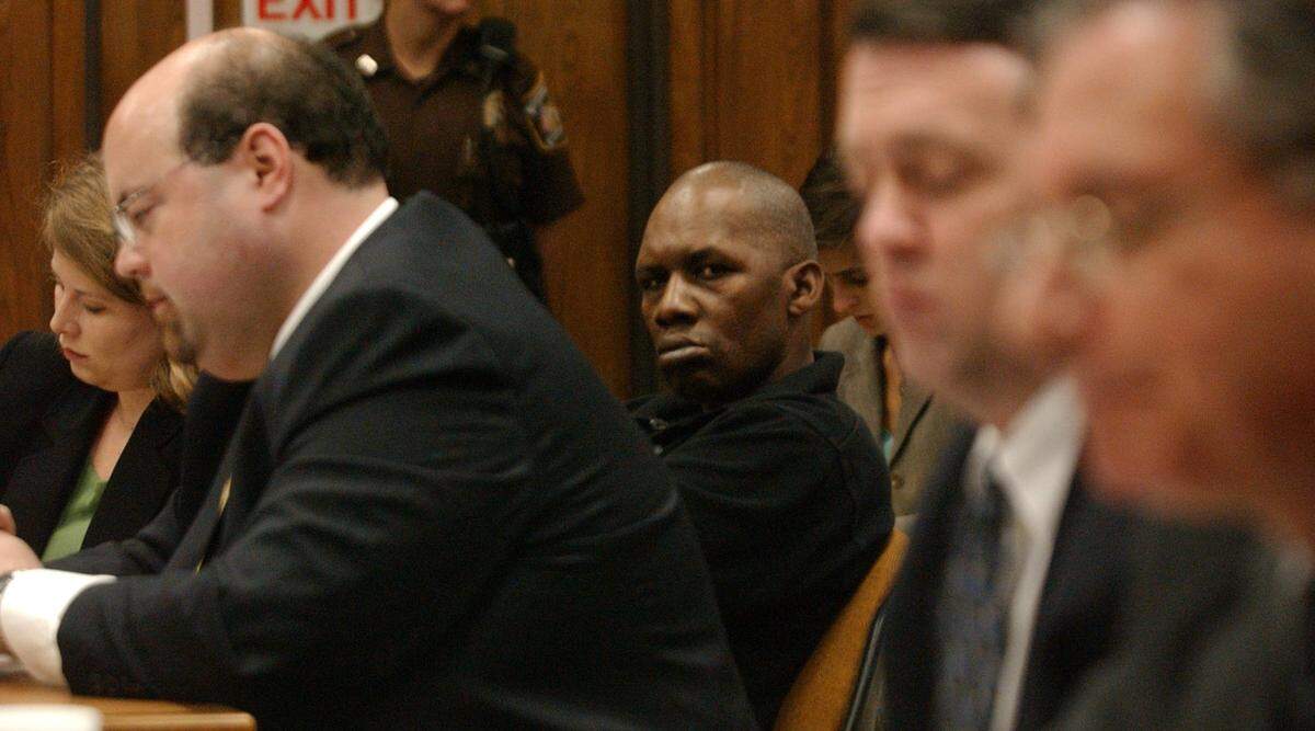 Surrounded by attorneys, defendant Floyd Lee Brown, 43, center, attended a hearing in 2007 in Durham Superior Court in which Orlando Hudson ordered he be released from Dorothea Dix Hospital. Brown, who is mentally impaired, has been held at Dix without trial since being charged with murder in 1993.