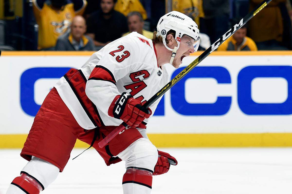Carolina Hurricanes left wing Brock McGinn (23) celebrates after scoring a goal against the Nashville Predators during the first period in Game 6 of an NHL hockey Stanley Cup first-round playoff series Thursday, May 27, 2021, in Nashville.