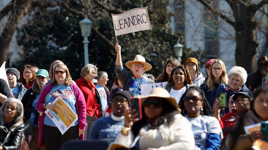 Supporters listen during a rally for education funding on the grounds of the N.C. State Capitol in Raleigh Thursday, Feb. 22, 2024. The rally happened as the state Supreme Court heard oral arguments in the long-running Leandro school funding case.