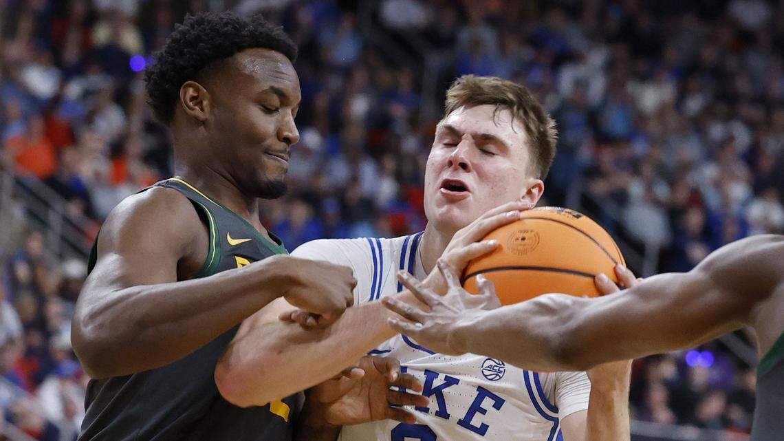 Duke’s Cooper Flagg (2) drives between Baylor’s Jalen Celestine (32) and VJ Edgecombe (7) during the first half of Duke’s game against Baylor in the second round of the 2025 NCAA men’s basketball championship at the Lenovo Center in Raleigh, N.C., Sunday, March 23, 2025.