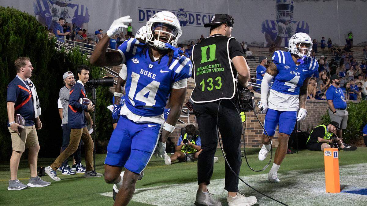 Duke’s Que’Sean Brown (14) celebrates after scoring a touchdown during the second half of the Blue Devils’ 26-21 win over UConn on Saturday, Sept. 14, 2024, at Wallace Wade Stadium in Durham, N.C.