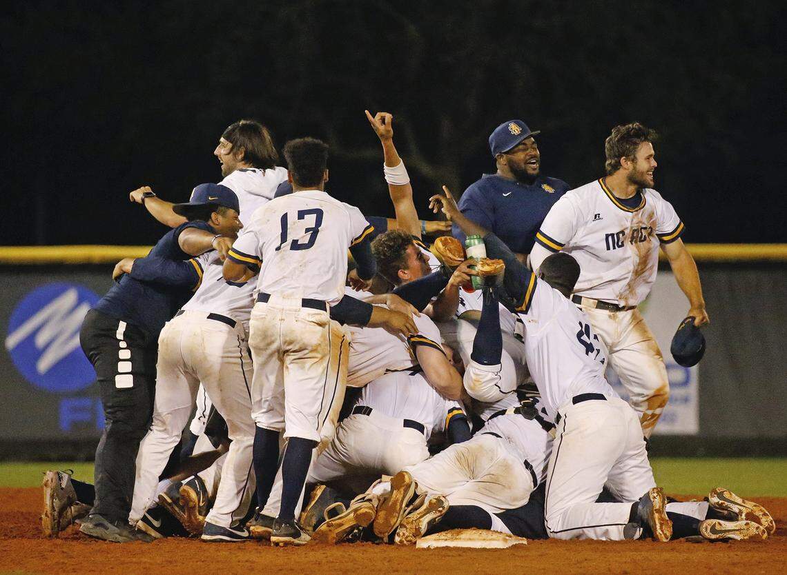 North Carolina A&T players celebrate after winning the MEAC Championship over Bethune-Cookman in a college baseball game in Daytona Beach, Fla., Sunday, May 20, 2018. NC A&T won, 12-9.