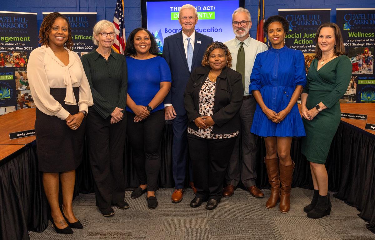 Chapel Hill-Carrboro Superintendent Nyah Hamlett (from left) and school board members Barbara Fedders, Riza Jenkins, George Griffin, Vickie Feaster Fornville, Mike Sharp, Rani Dasi and Meredith Ballew.