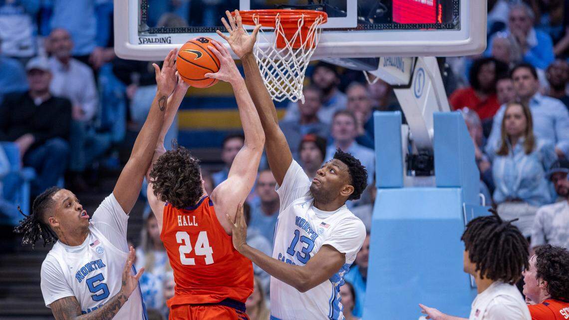 Clemson’s P.J. Hall (24) puts up a shot against North Carolina’s Armando Bacot (5) and Jalen Washington (13) in the second half on Tuesday, February 6, 2024 at the Dean E. Smith Center in Chapel Hill, N.C. Hall led all scores with 25 points in the Tigers’ 80-76 victory.