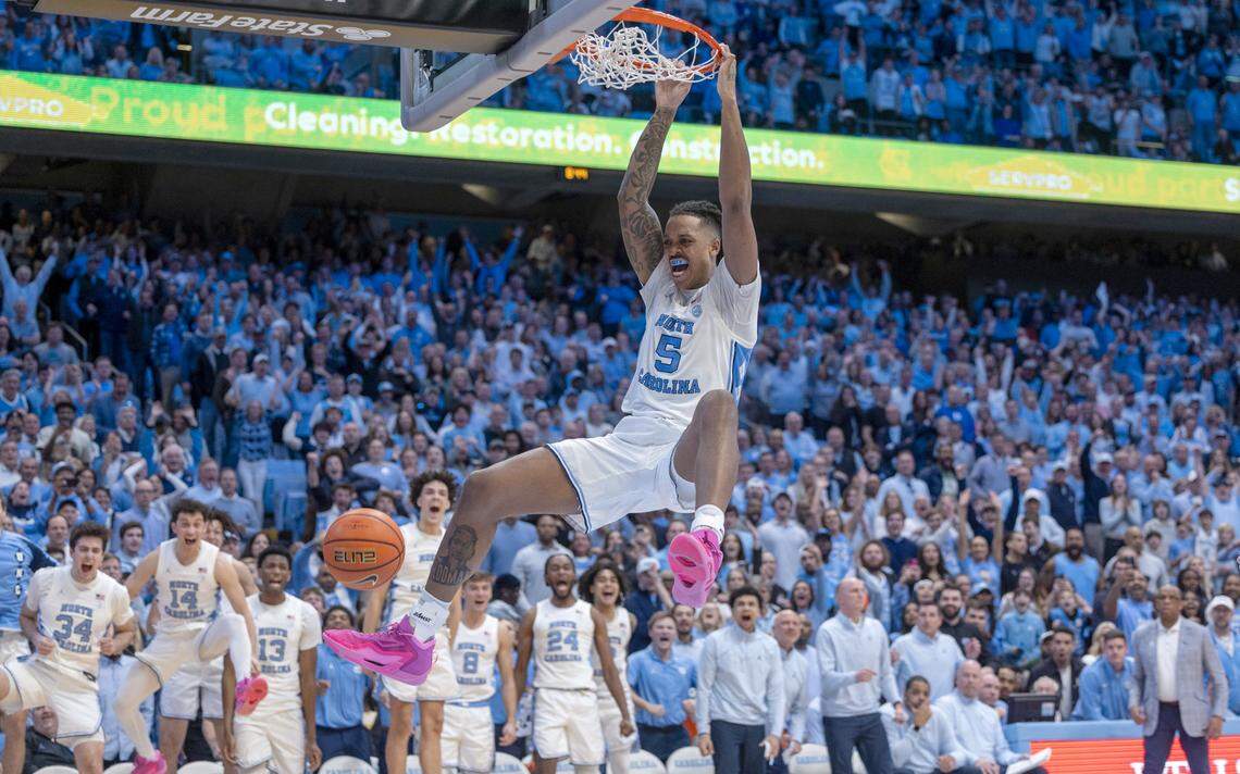 North Carolina’s Armando Bacot (5) gets a dunk on a fast break to secure the Tar Heels’ 93-84 victory with ten seconds to play against Duke on Saturday, February, 3, 2024 at the Dean E. Smith Center in Chapel Hill, N.C. Bacot led all scores with 25 points.