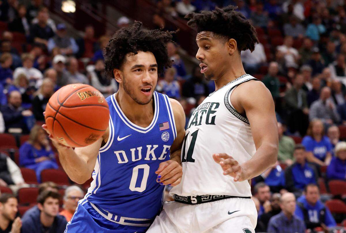 Duke’s Jared McCain (0) passes around the pressure by Michigan State’s A.J. Hoggard (11) during the second half of Duke’s 74-65 victory over Michigan State in the Champions Classic at the United Center in Chicago, IL, Tuesday, Nov. 14, 2023.