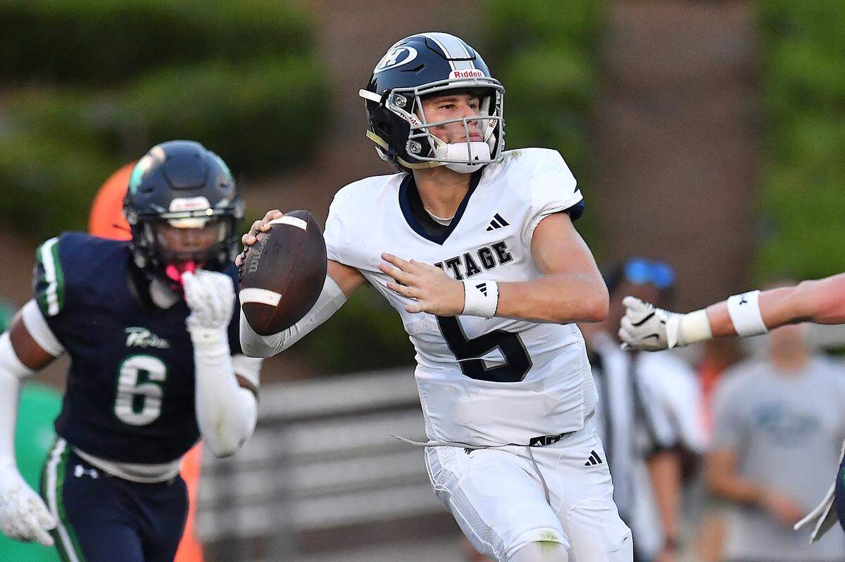 Heritage quarterback Cole Perry (5) looks to pass towards the sidelines against Leesville Road during the first half.  The Leesville Road Pride and the Heritage Huskies met in a  football game in Raleigh, N.C. on September 5, 2025.