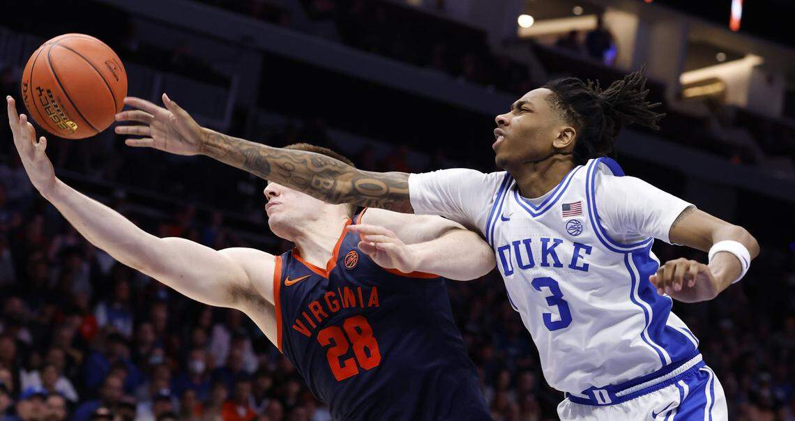 Virginia's Thijs de Ridder (28) beats Duke’s Isaiah Evans (3) to the rebound during the first half of Duke’s game against Virginia in the finals of the 2026 ACC Men’s Basketball Tournament at the Spectrum Center in Charlotte, N.C., Saturday, March 14, 2026.