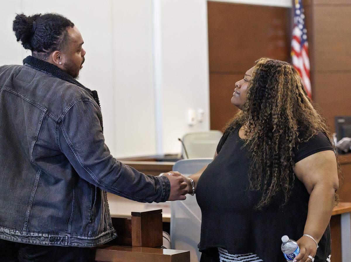 Brenay Kennard, right, and her husband, Timothy Montague, leave a Durham County courtroom on Tuesday, March 24, 2026, after a judge ordered Kennard to pay $40,000 while she appeals a judgment ordering her to pay $1.75 million in damages. Kennard filed a motion to stay the enforcement of a November 2025 order for her to pay Akira Montague for alienation of affection and criminal conversation.