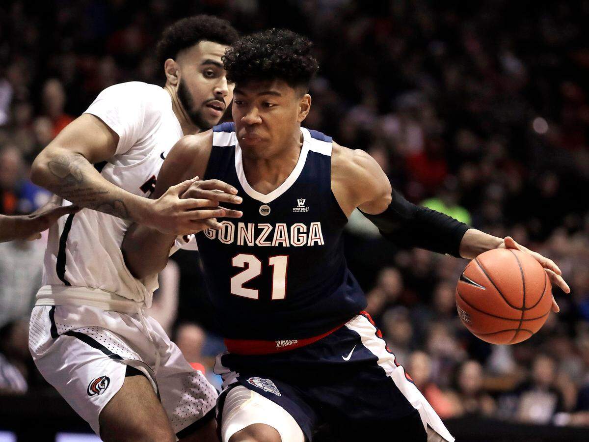 Gonzaga’s Rui Hachimura (21) drives the ball against Pacific’s Jeremiah Bailey during the first half of an NCAA college basketball game Thursday, Feb. 28, 2019, in Stockton, Calif. (AP Photo/Ben Margot)