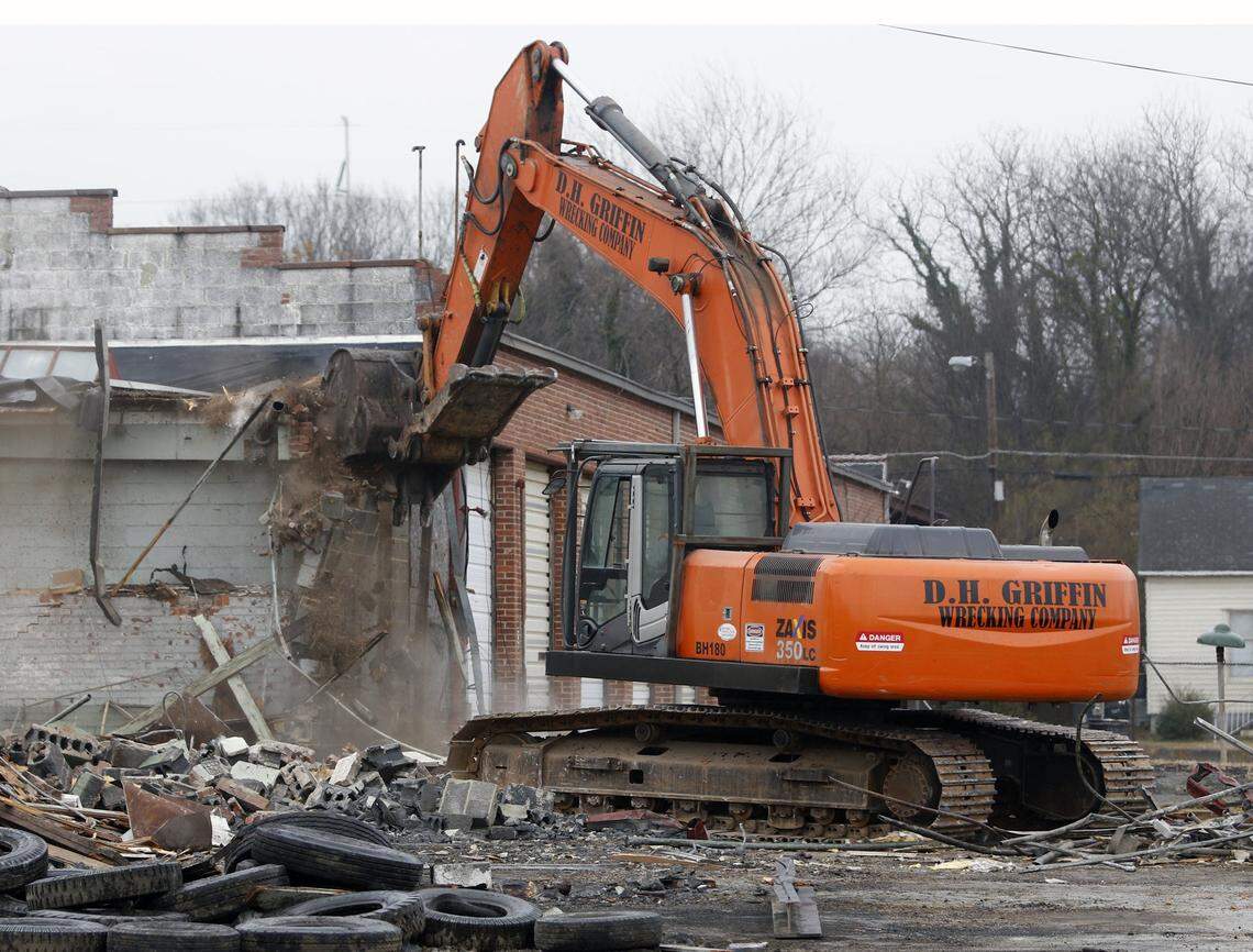 A large piece of machinery started the demolition of the long bus garage building Tuesday, March 3rd, 2015 at the old Greyhound ‘Carolina Coach’ warehouse and outbuilding complex on South Blount Street in downtown Raleigh. Demolition permits had been approved by the City of Raleigh for four of the five buildings on site.