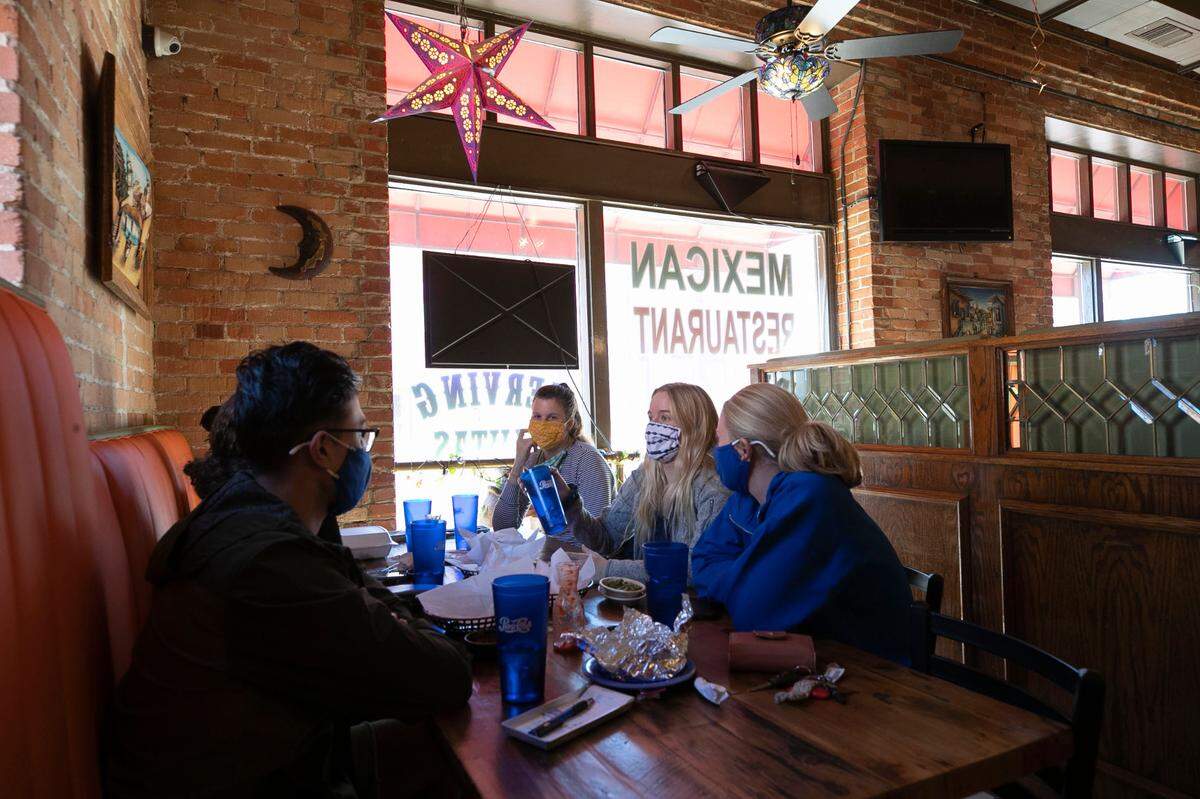 A group of Duke students have lunch at El Rodeo Mexican Restaurant in Brightleaf Square on Tuesday, February 23, 2021 in Durham, N.C. The restaurant which has been a staple in downtown Durham since 1989 will close at the end of March 2021.