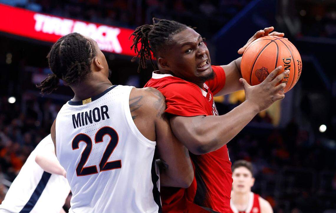 N.C. State’s DJ Burns Jr. (30) gets around Virginia’s Jordan Minor (22) during the second half of N.C. State’s 72-65 overtime victory over Virginia in the semifinals of the 2024 ACC Men’s Basketball Tournament at Capital One Arena in Washington, D.C., Friday, March 15, 2024.